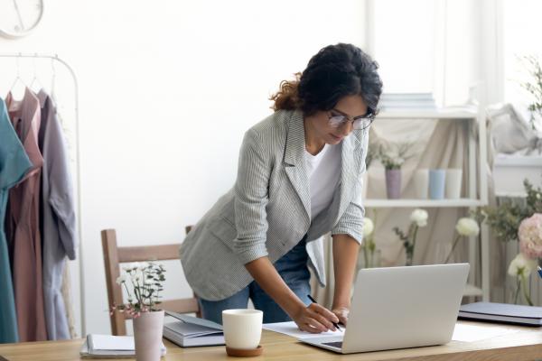 small business owner calculating her budget and profit